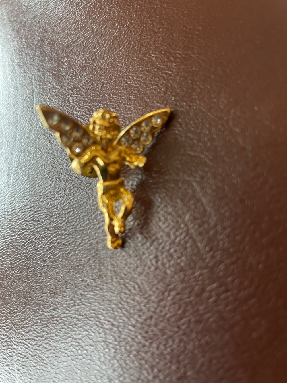 Gold tone angel with rhinestone wings